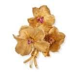 TIFFANY & CO., A VINTAGE RUBY FLOWER BROOCH in 18ct yellow gold, designed as a spray of flowers, ...