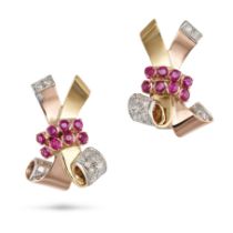 A PAIR OF RETRO RUBY AND DIAMOND CLIP EARRINGS in yellow and rose gold, in scrolling design set w...