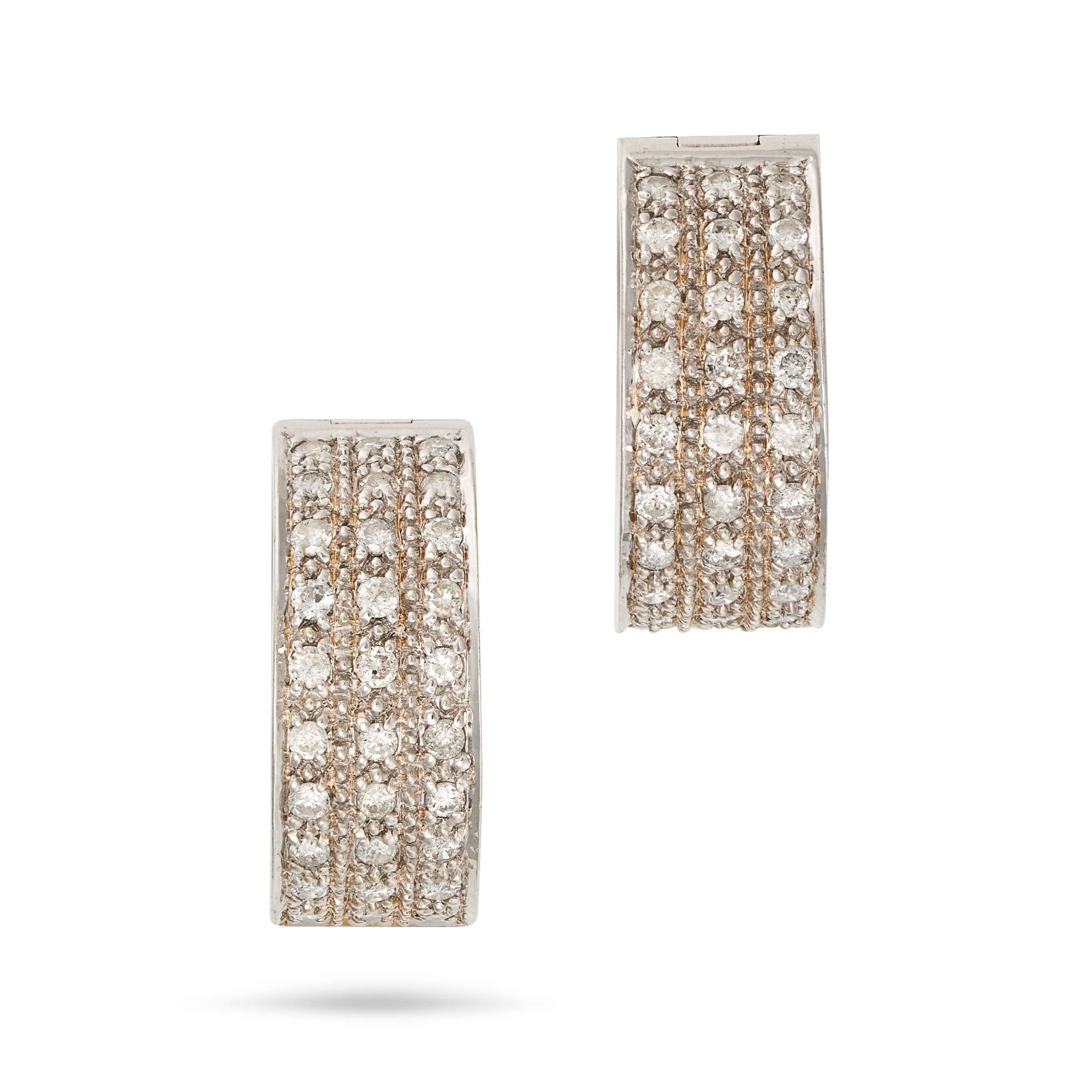 A PAIR OF DIAMOND HOOP EARRINGS in 18ct white gold, each designed as a hoop set with three rows o...