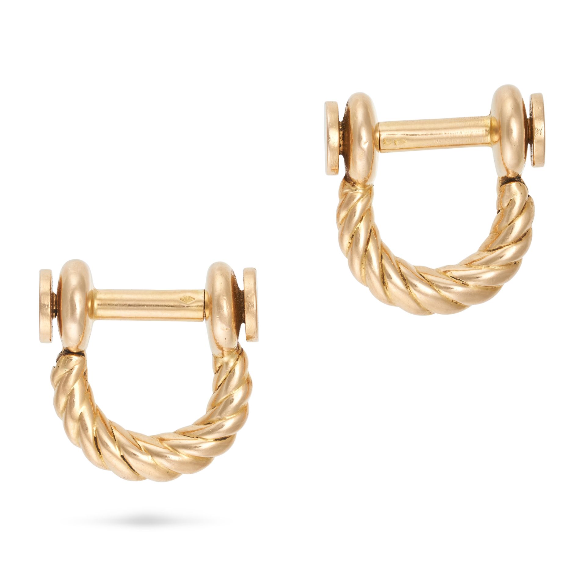 HERMES, A PAIR OF STIRRUP CUFFLINKS in 18ct yellow gold, designed as fluted stirrups, Gaetan de P...