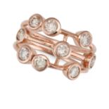 A DIAMOND BUBBLE RING in 9ct rose gold, the openwork band set with round brilliant cut diamonds a...