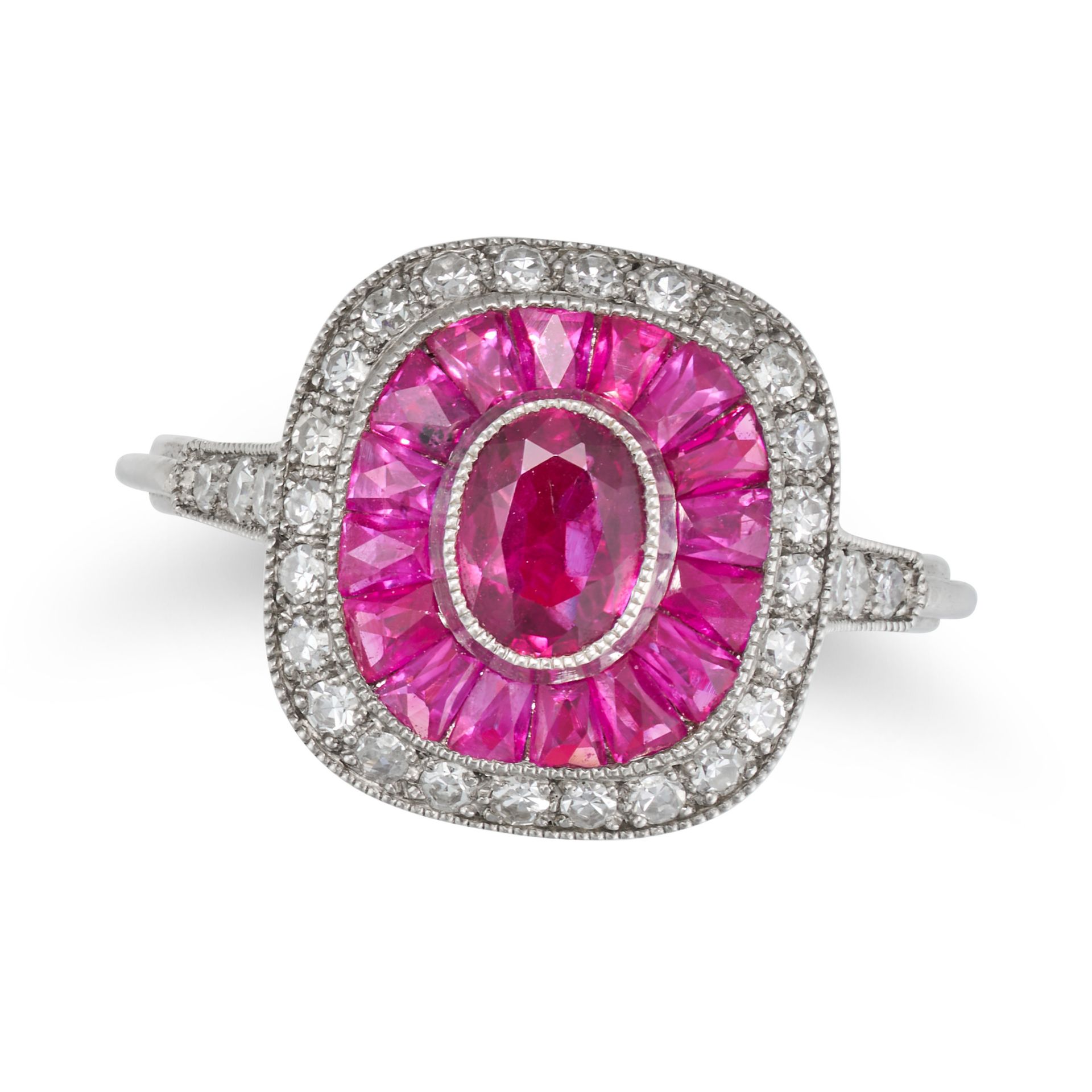 A RUBY AND DIAMOND TARGET RING in platinum, set with an oval cut ruby in a border of calibre cut ...