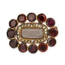 NO RESERVE - AN ANTIQUE GARNET AND PEARL MOURNING BROOCH comprising a cushion shaped glass locket...