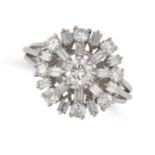 A DIAMOND CLUSTER RING in platinum, set with a round brilliant cut diamond in a cluster of baguet...