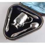 A LATE VICTORIAN SILVER CHRISTENING SET