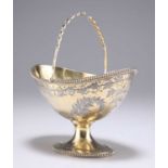 A VICTORIAN SILVER-GILT SWING HANDLE BASKET