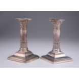 A PAIR OF LATE VICTORIAN SILVER CORINTHIAN COLUMN CANDLESTICKS