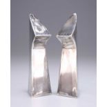 A PAIR OF MODERNIST SILVER PEPPER POTS