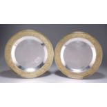 STUART DEVLIN (1931-2018), A PAIR OF PARCEL-GILT SILVER PLATES