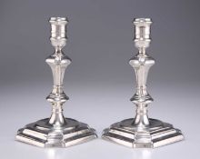 A PAIR OF GEORGE I CAST SILVER CANDLESTICKS