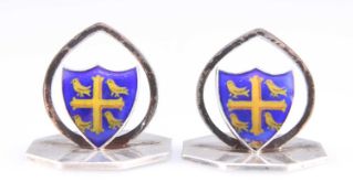 A PAIR OF EDWARDIAN SILVER AND ENAMEL UNIVERSITY COLLEGE OXFORD MENU HOLDERS