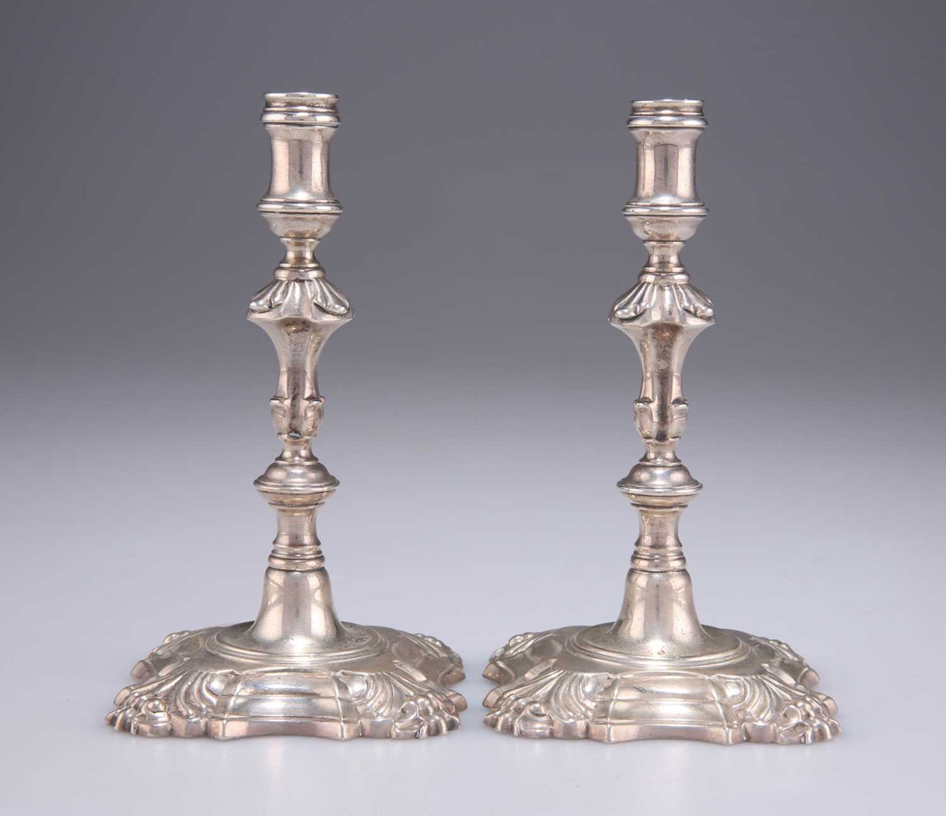 A PAIR OF GEORGE II CAST SILVER TAPERSTICKS - Image 2 of 3