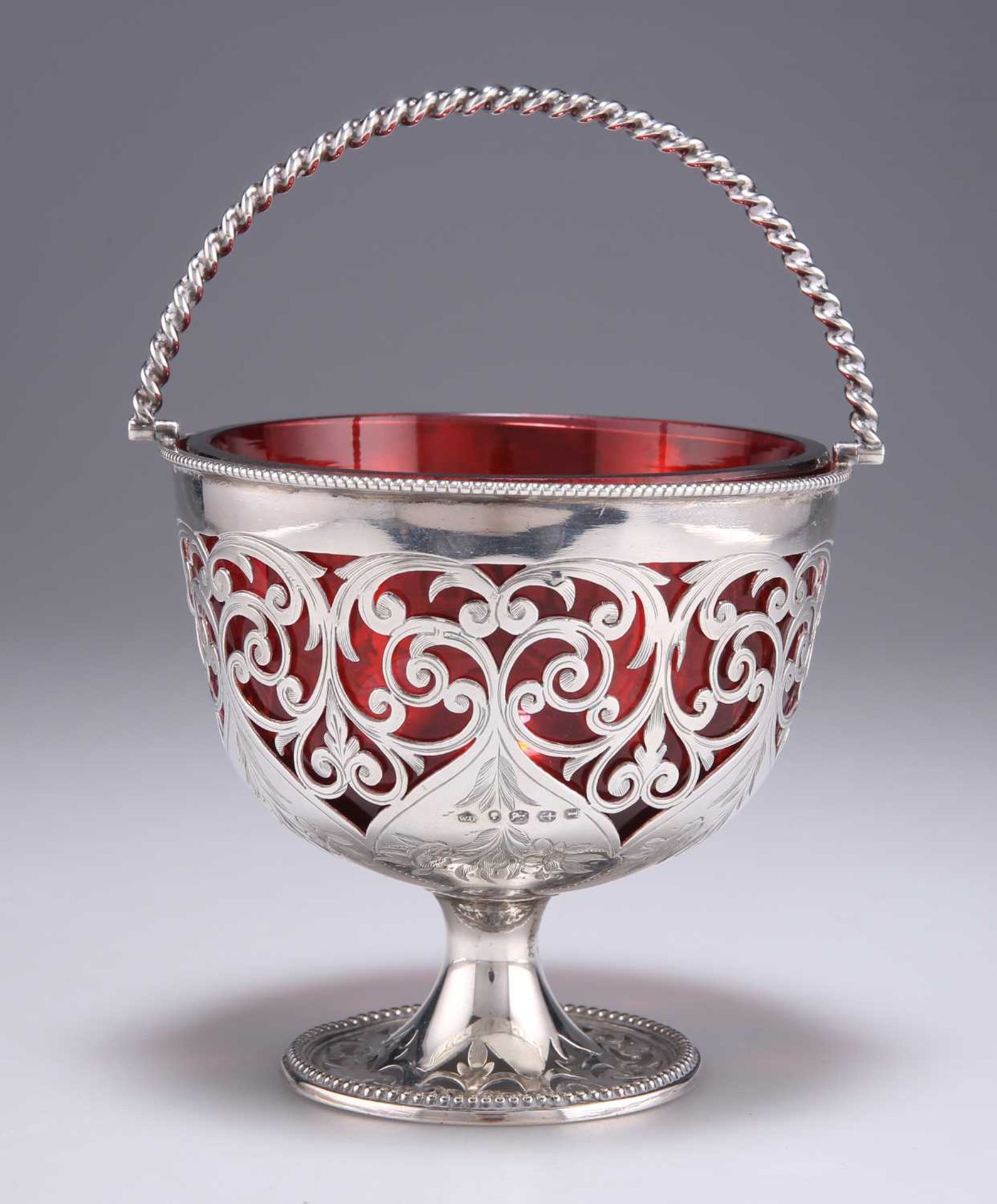 A VICTORIAN SILVER AND RUBY GLASS SUGAR BASKET