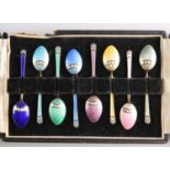 A SET OF EIGHT ELIZABETH II SILVER-GILT AND ENAMEL COFFEE SPOONS