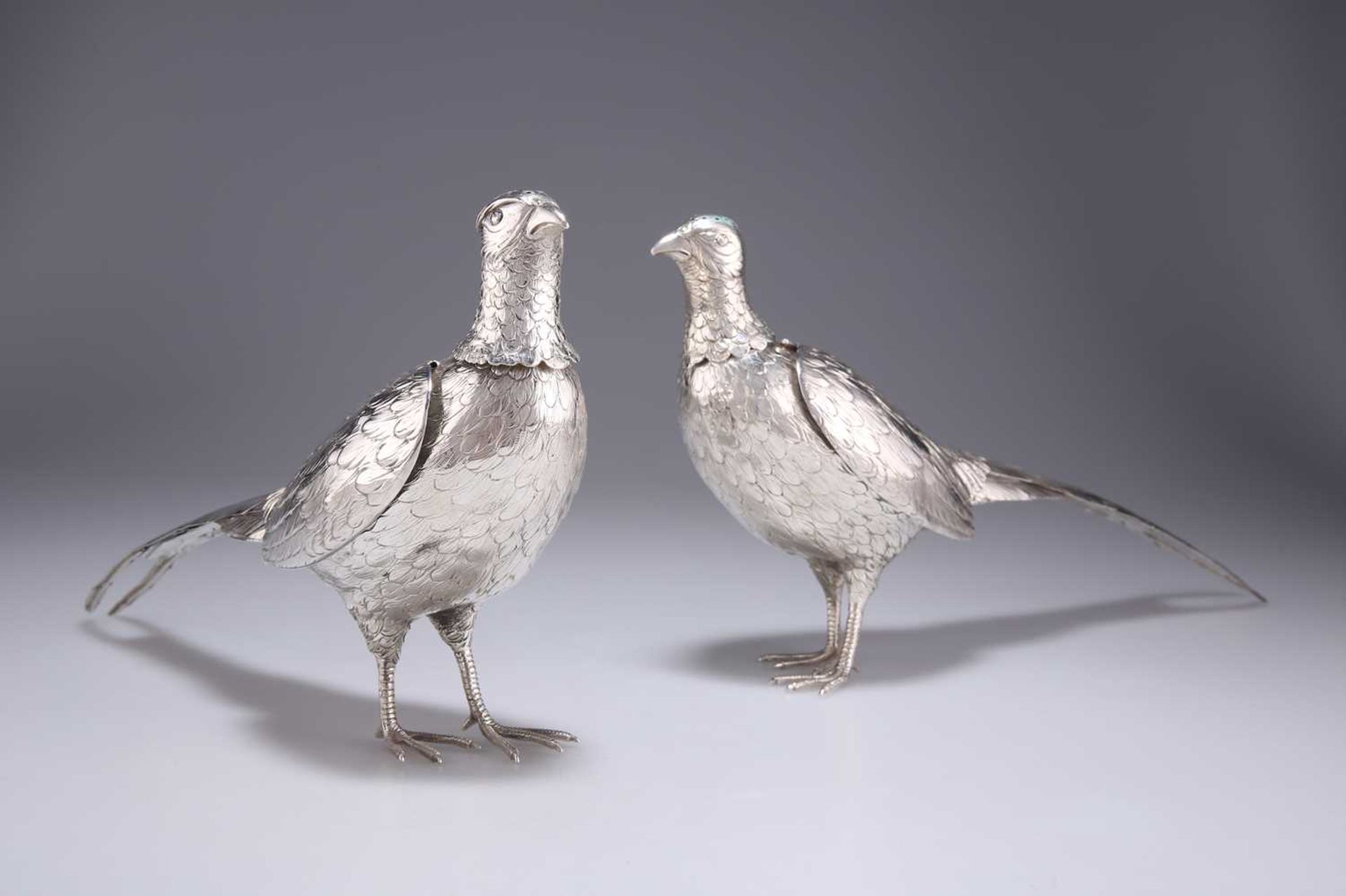 A PAIR OF GERMAN SILVER PHEASANT PEPPERS, CIRCA 1890