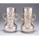 A PAIR OF 19TH CENTURY TWIN-HANDLED VASES