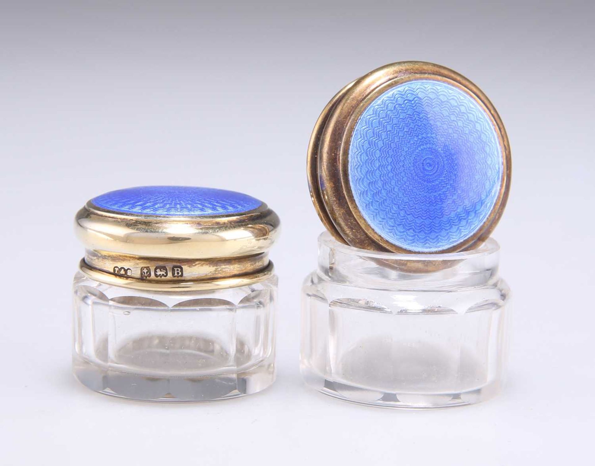 A PAIR OF GEORGE V SILVER AND BLUE ENAMEL JARS