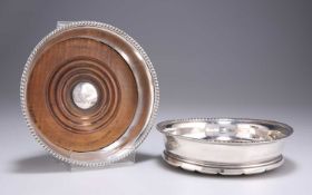 A MATCHED PAIR OF EARLY 19TH CENTURY SILVER WINE COASTERS