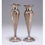 A NEAR PAIR OF EDWARDIAN SILVER VASES