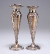 A NEAR PAIR OF EDWARDIAN SILVER VASES