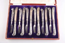 A SET OF SIX PAIRS OF EDWARDIAN SILVER-HANDLED DESSERT KNIVES AND FORKS
