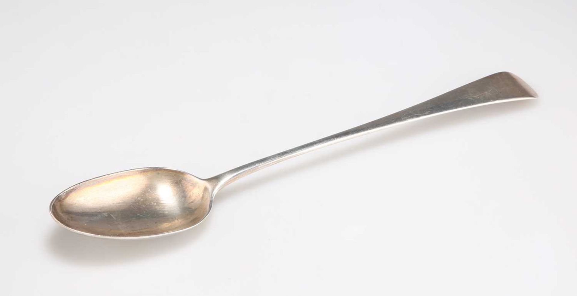 A GEORGE III SILVER BASTING SPOON