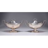 A PAIR OF GEORGE III SILVER SAUCE TUREENS AND COVERS