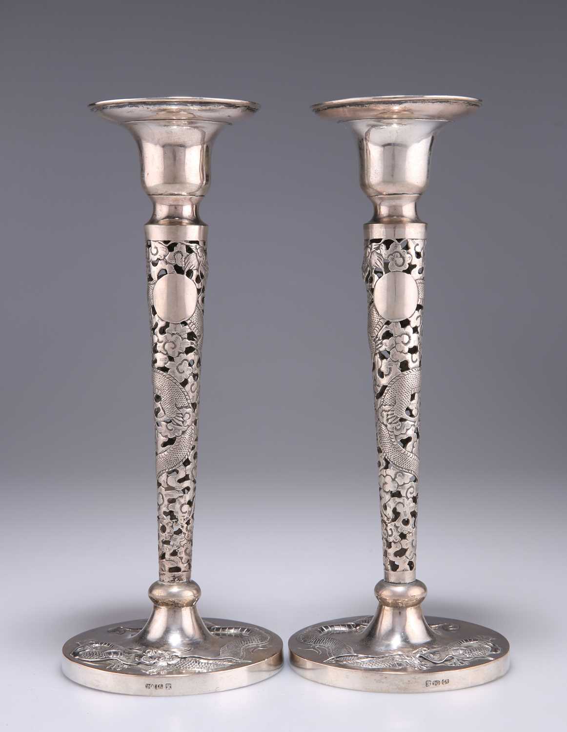 A PAIR OF CHINESE EXPORT SILVER CANDLESTICKS