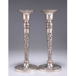 A PAIR OF CHINESE EXPORT SILVER CANDLESTICKS
