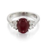 AN 18 CARAT WHITE GOLD RUBY AND DIAMOND RING