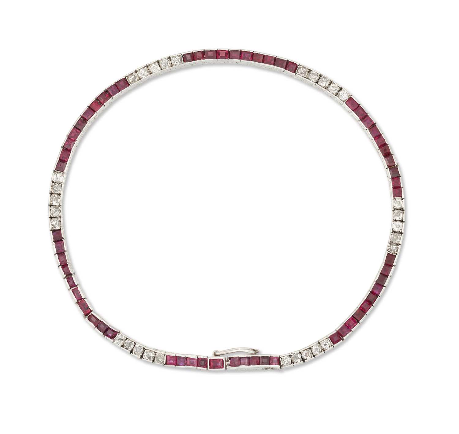 AN EARLY 20TH CENTURY RUBY AND DIAMOND LINE BRACELET
