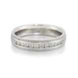 A PLATINUM DIAMOND HALF HOOP RING