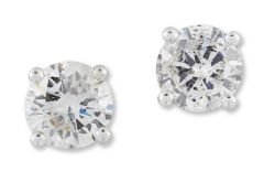 A PAIR OF SOLITAIRE DIAMOND STUD EARRINGS