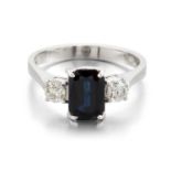 AN 18 CARAT WHITE GOLD SAPPHIRE AND DIAMOND THREE STONE RING