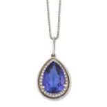 AN 18 CARAT WHITE GOLD TANZANITE AND DIAMOND CLUSTER PENDANT ON A PLATINUM CHAIN