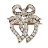 AN EARLY 20TH CENTURY DIAMOND TWIN HEART BROOCH