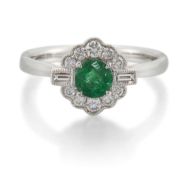 AN 18 CARAT WHITE GOLD EMERALD AND DIAMOND CLUSTER RING