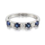 A PLATINUM SAPPHIRE AND DIAMOND HALF HOOP RING