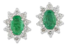 A PAIR OF EMERALD AND DIAMOND CLUSTER EARRINGS