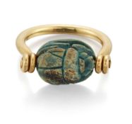 AN EGYPTIAN FAÏENCE SCARAB SWIVEL RING