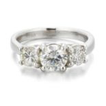 AN 18 CARAT WHITE GOLD DIAMOND THREE STONE RING