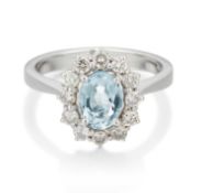 AN 18 CARAT WHITE GOLD AQUAMARINE AND DIAMOND CLUSTER RING