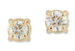A PAIR OF SOLITAIRE DIAMOND STUD EARRINGS