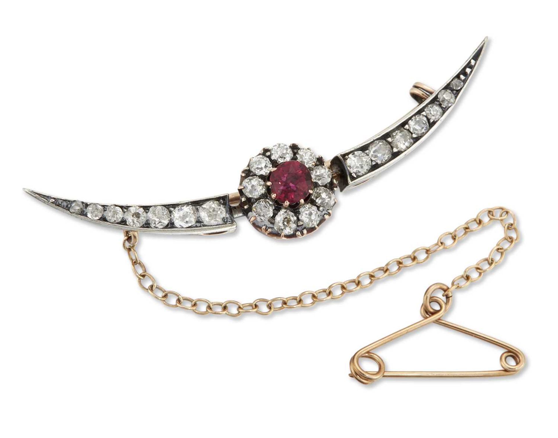 A LATE 19TH / EARLY 20TH CENTURY RUBY AND DIAMOND CRESCENT CLUSTER BROOCH