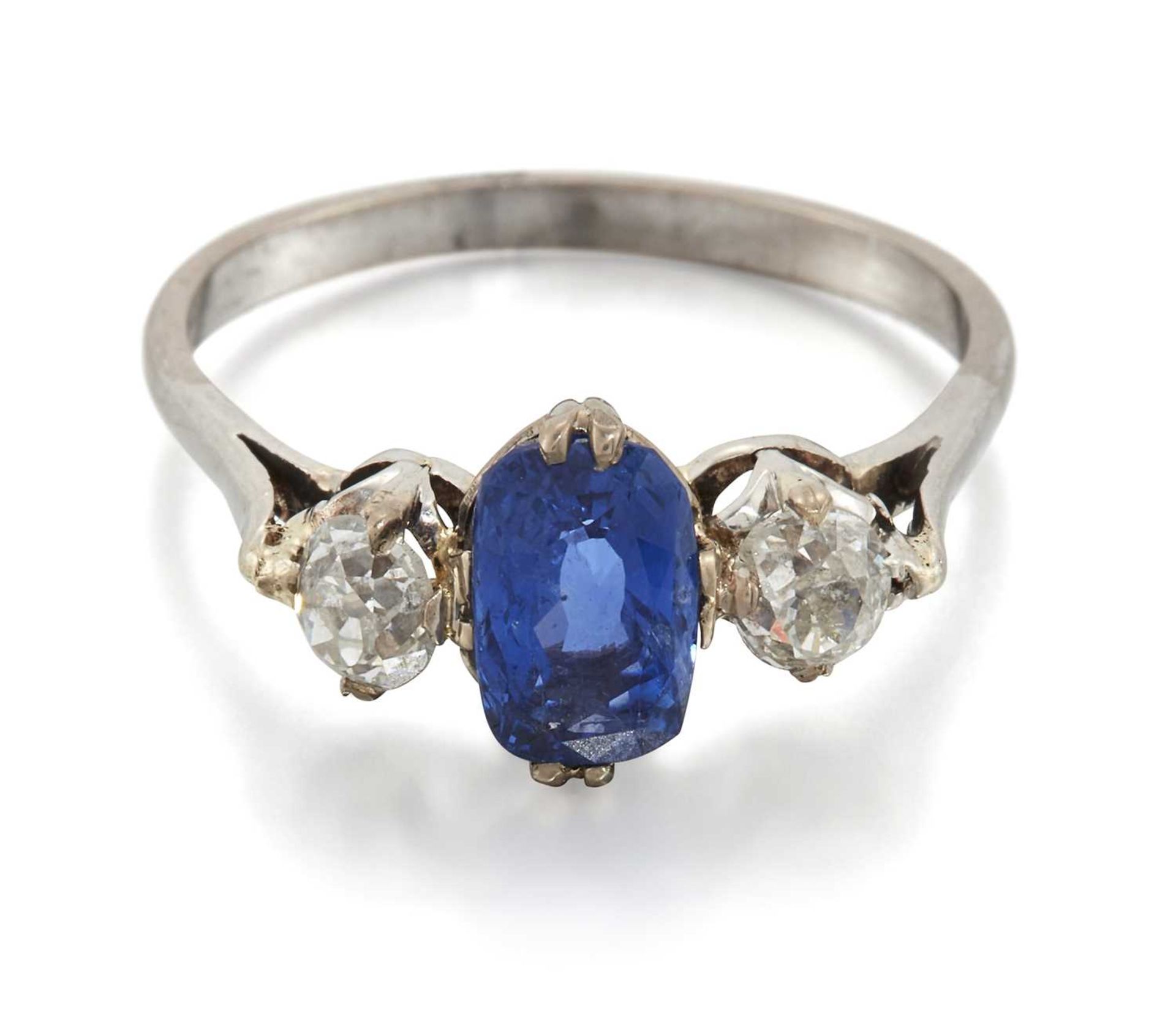 A SAPPHIRE AND DIAMOND THREE STONE RING