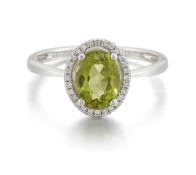 A PLATINUM PERIDOT AND DIAMOND CLUSTER RING