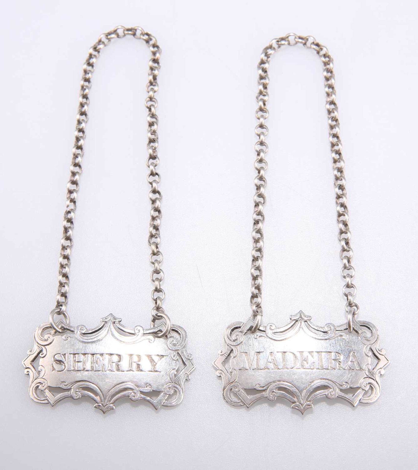 A PAIR OF VICTORIAN SILVER WINE LABELS