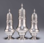 A GRADUATED SET OF THREE GEORGE II SCOTTISH SILVER CASTERS
