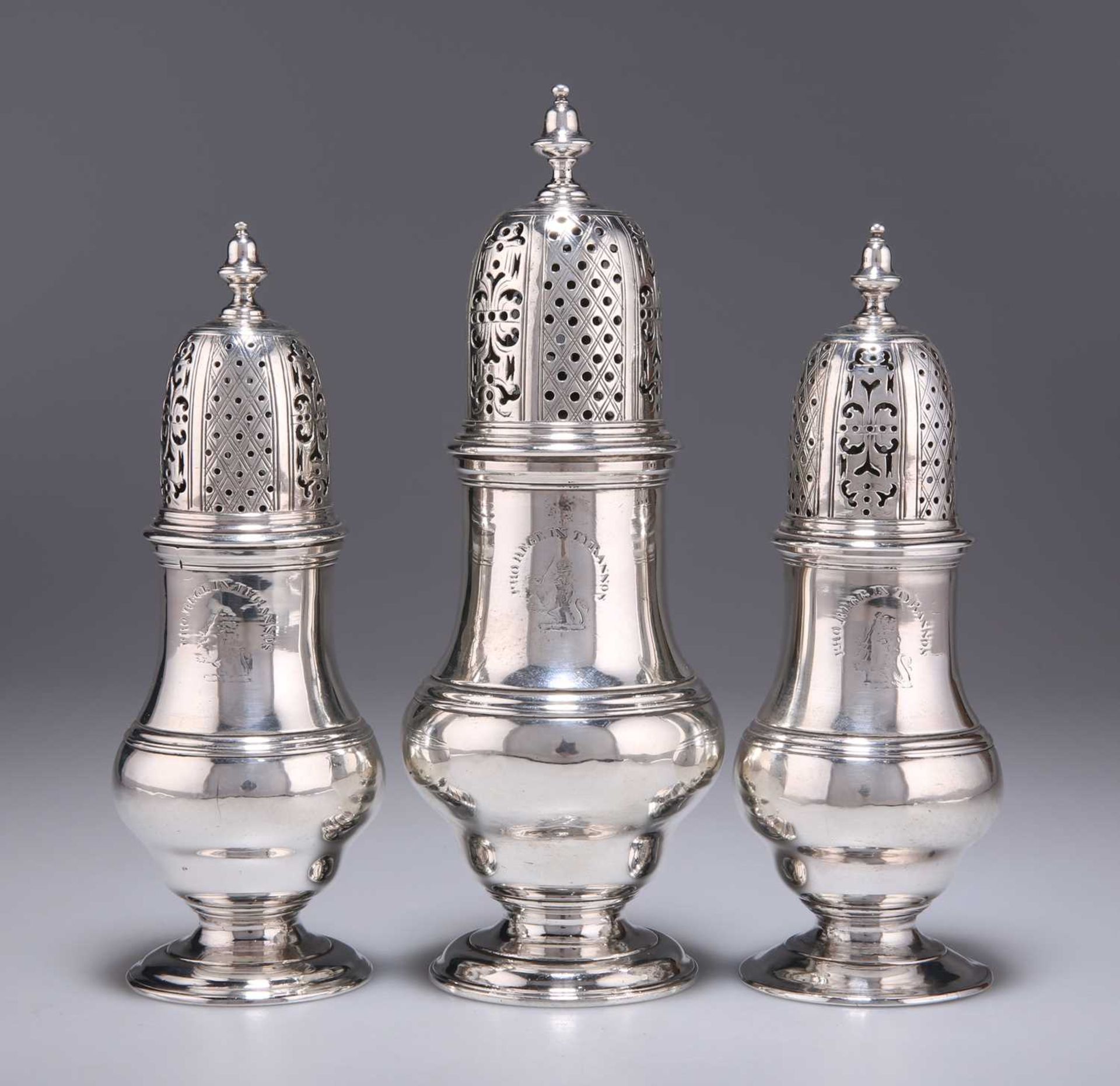 A GRADUATED SET OF THREE GEORGE II SCOTTISH SILVER CASTERS