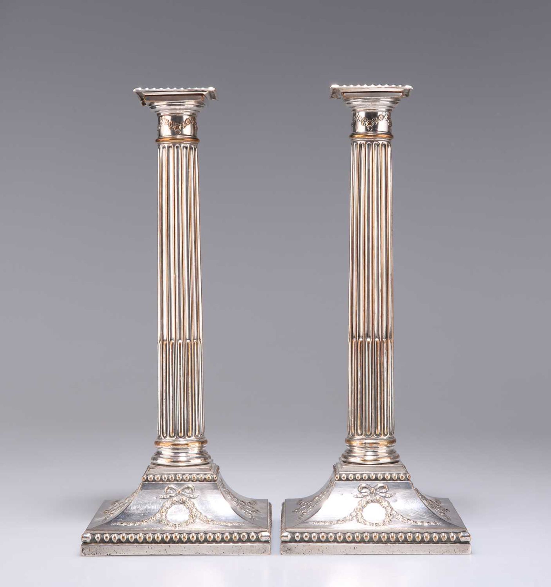 A PAIR OF GEORGE III OLD SHEFFIELD PLATE COLUMNAR CANDLESTICKS